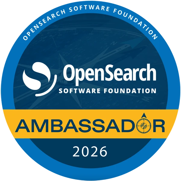 The circular OpenSearch Software Foundation Ambassador 2026 badge. A blue ring reads OpenSearch Software Foundation around the top, the OpenSearch Software Foundation logo sits in the center over a faint compass, and a gold band across the lower half reads Ambassador with a compass rose in place of the letter O, above the year 2026.